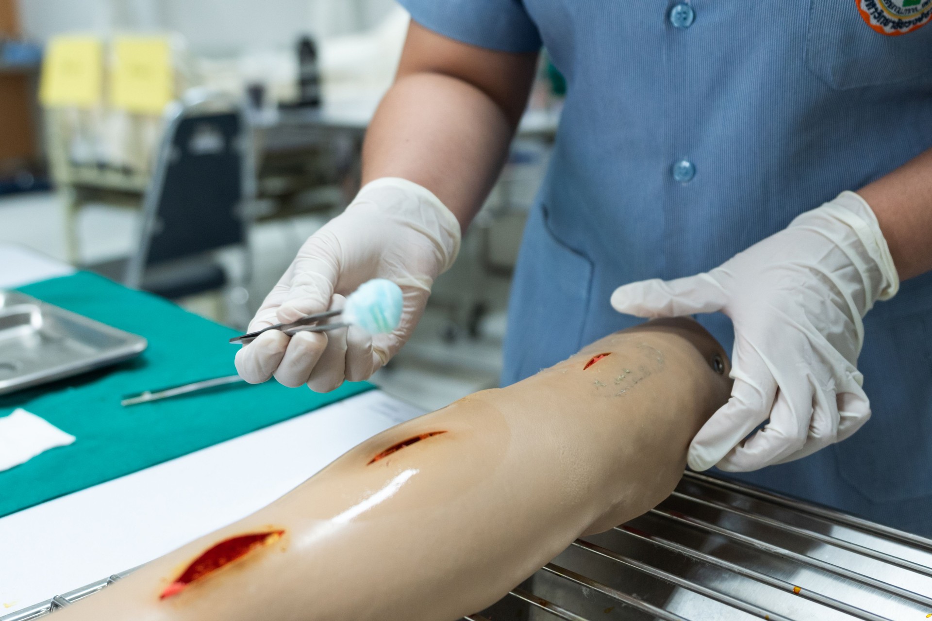 Medical Student Practicing Wound Care on a Training Mannequin